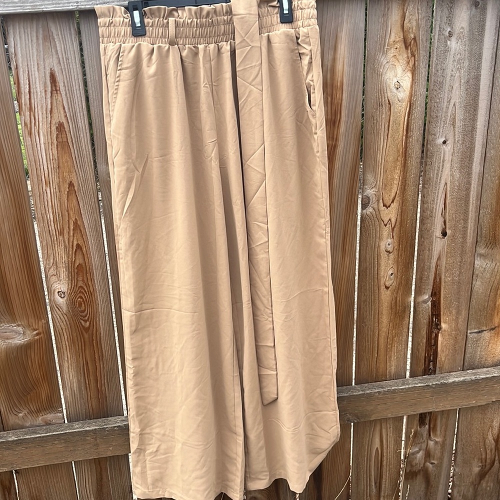 Never worn high waisted wide like khaki pants